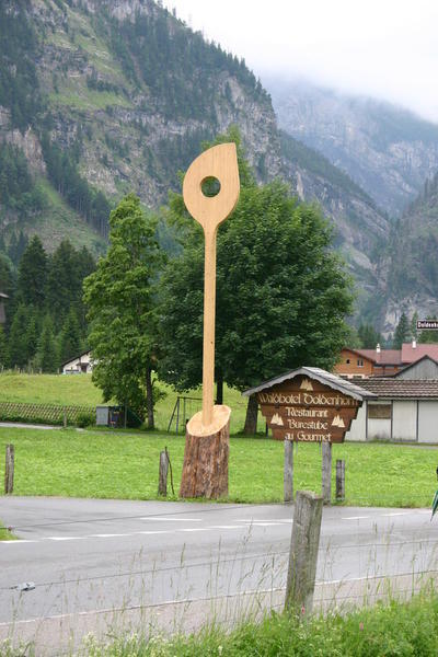 The road to the Waldhotel Doldenhorn is marked by a LARGE wooden spoon!